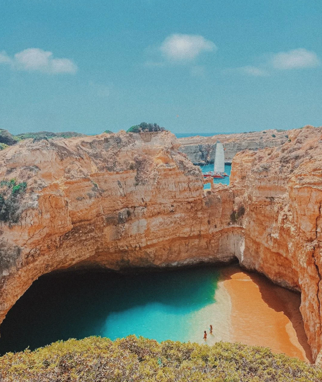 The iconic golden cliffs and emerald green waters of Ponta da Piedade in the Algarve region